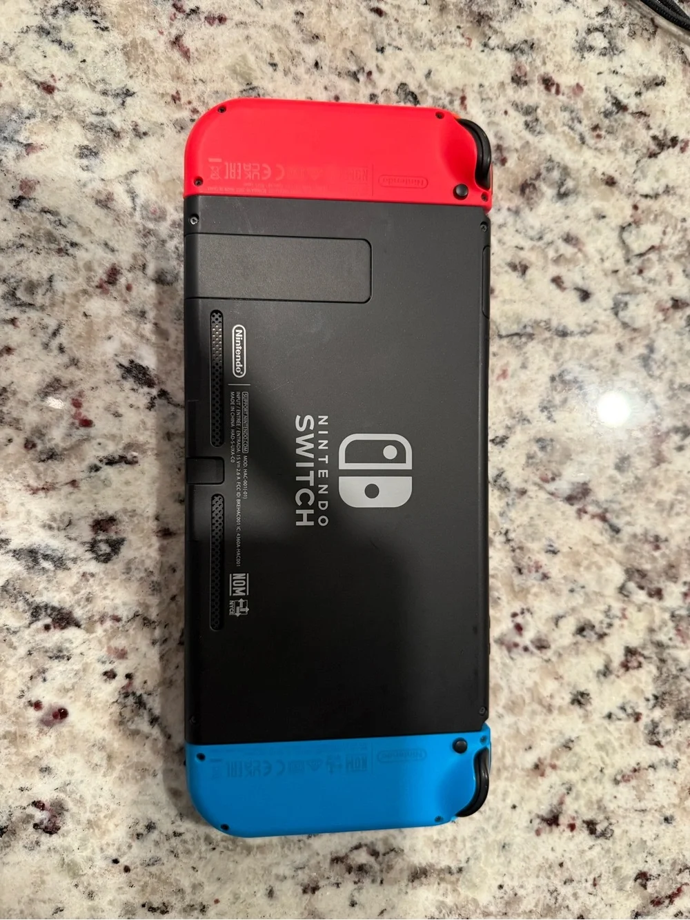 Nintendo Switch with Blue and Red Joy-Con